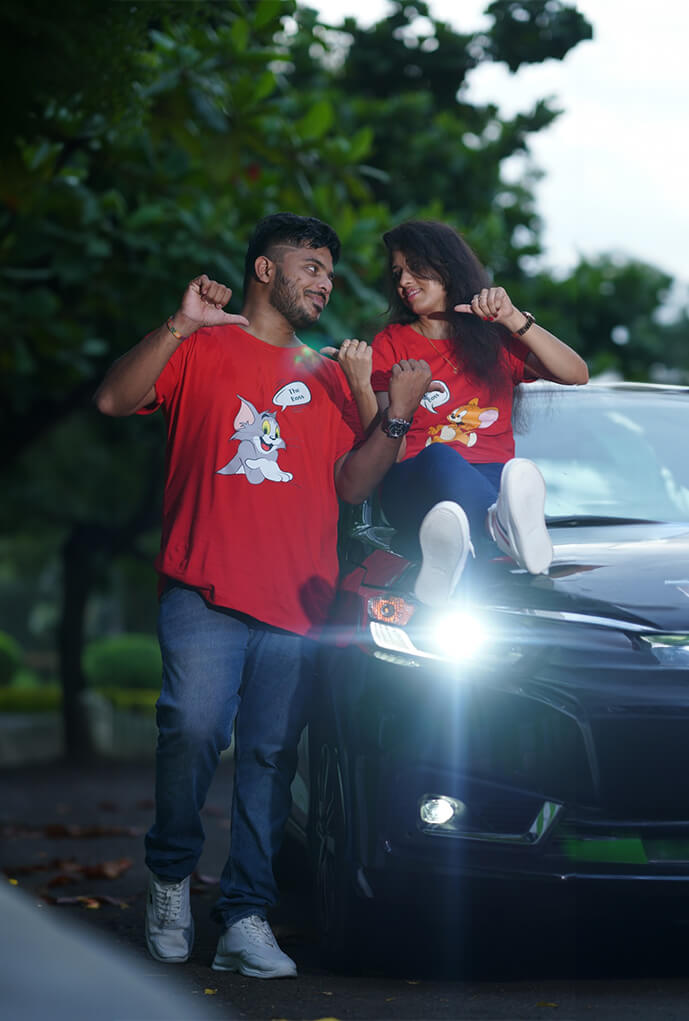 Real-life couple wearing Matchy couple tees for their prewedding shoot posing road side