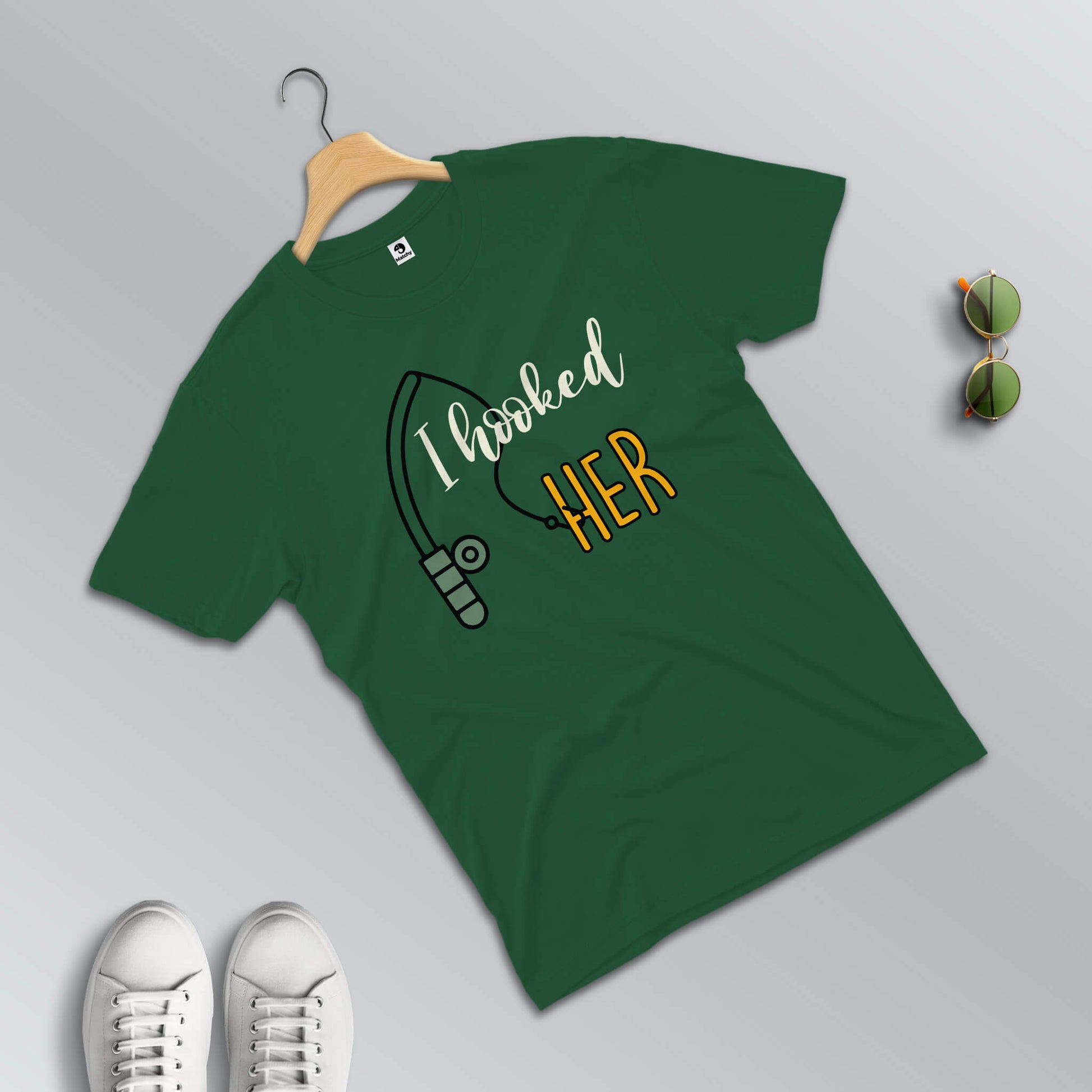 I hooked her-He caught me T-shirts for couples in green (male t-shirt in focus)