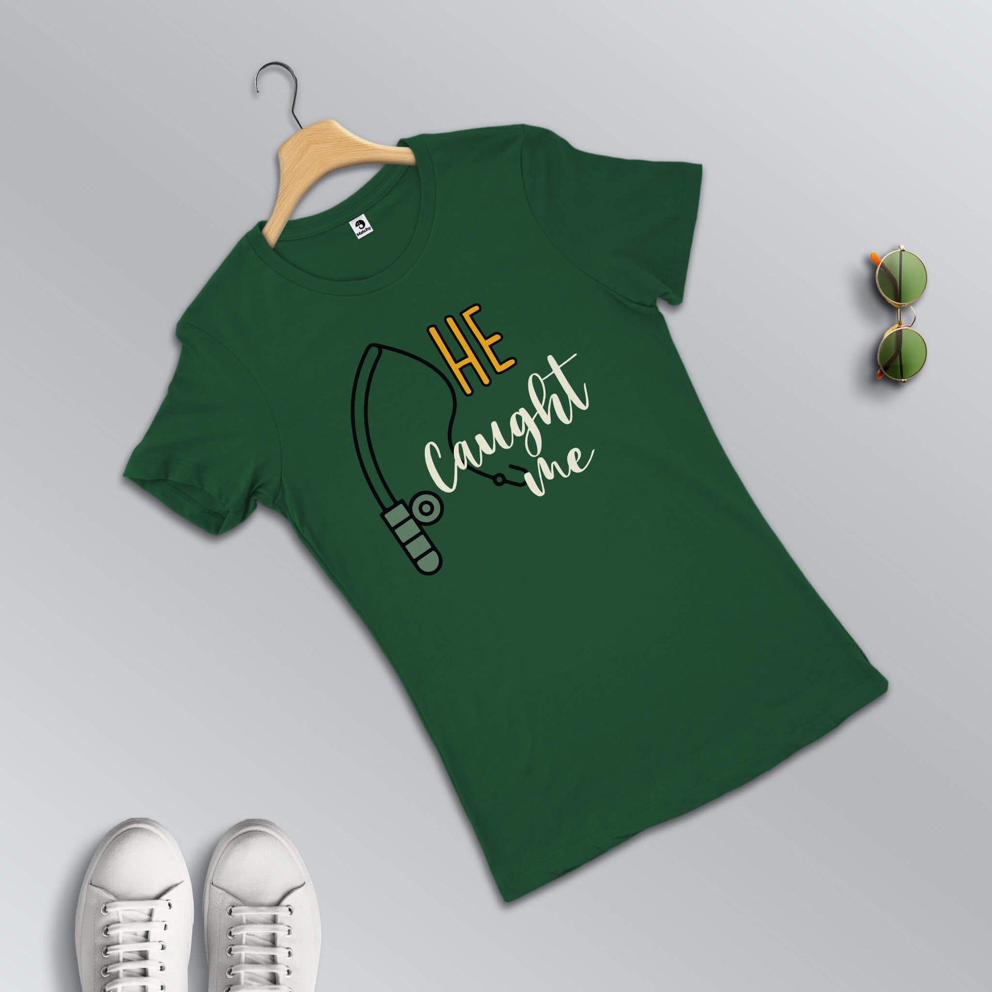 I hooked her-He caught me T-shirts for couples in green (female t-shirt in focus)
